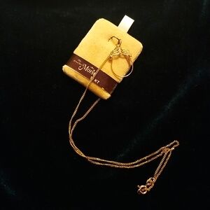 10kt gold pendant charm on a 10kt gold chain necklace